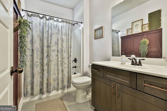 full bathroom featuring vanity, toilet, tile patterned flooring, and shower / bath combo