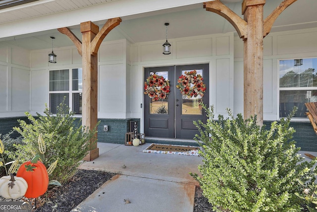 view of exterior entry featuring french doors