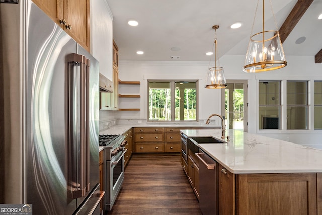 kitchen featuring a sink, light stone countertops, open shelves, high end appliances, and pendant lighting