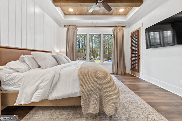 bedroom with recessed lighting, a raised ceiling, wood finished floors, wooden ceiling, and baseboards