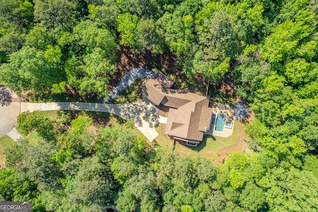 aerial view featuring a view of trees