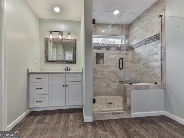 bathroom featuring vanity and a shower with shower door