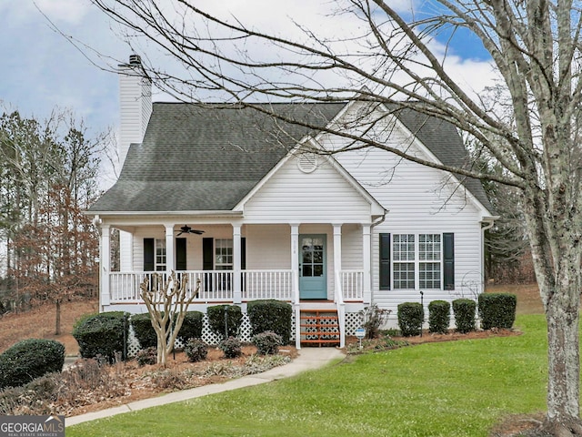 view of front of home with a porch, a front yard, and ceiling fan