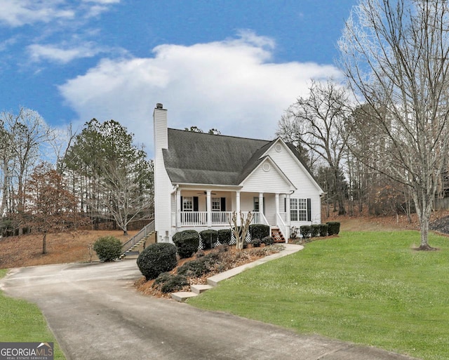 view of front of home featuring a front lawn and a porch