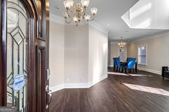 unfurnished dining area featuring dark hardwood / wood-style flooring, a notable chandelier, and crown molding