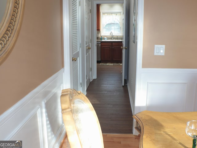 hall with dark hardwood / wood-style floors and sink