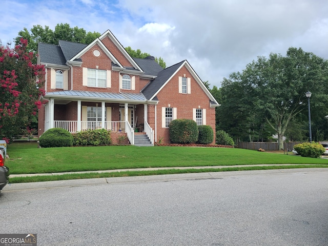 craftsman inspired home with covered porch and a front lawn