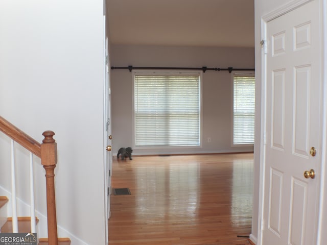 interior space with plenty of natural light and light hardwood / wood-style floors