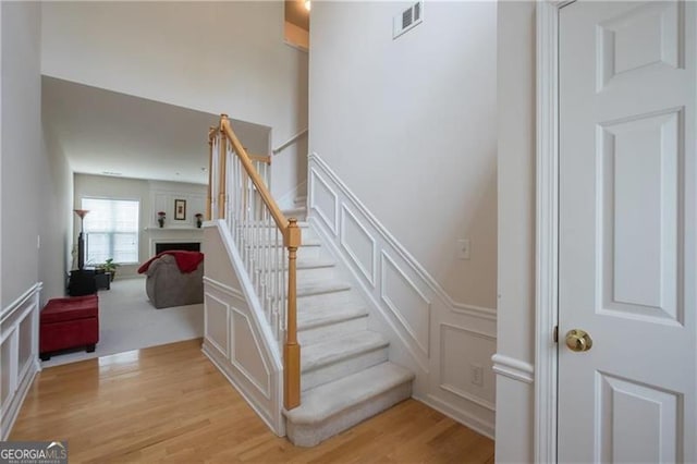 staircase featuring hardwood / wood-style flooring