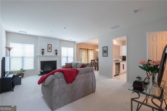 living room featuring light carpet