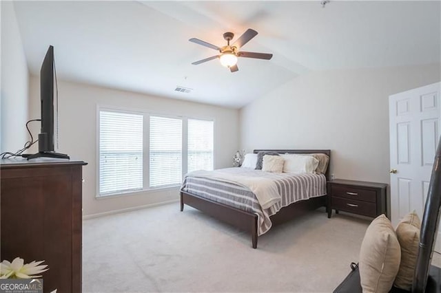 bedroom featuring lofted ceiling with beams, light carpet, and ceiling fan