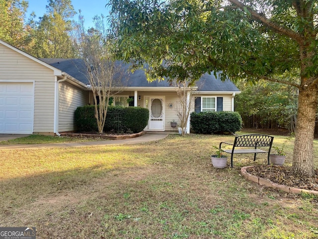 single story home featuring a front lawn and an attached garage