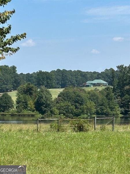 property view of mountains with a water view and a rural view