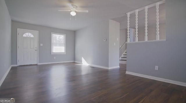 entrance foyer with ceiling fan and dark hardwood / wood-style flooring