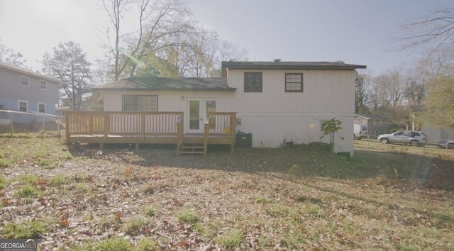 back of house featuring a wooden deck