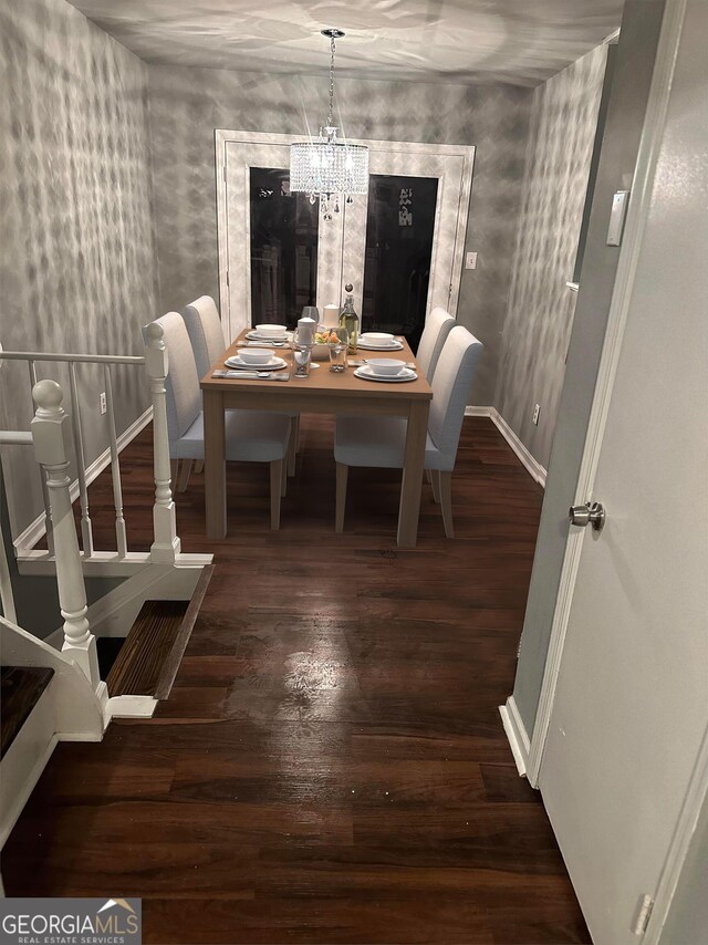 dining room featuring hardwood / wood-style flooring and a notable chandelier