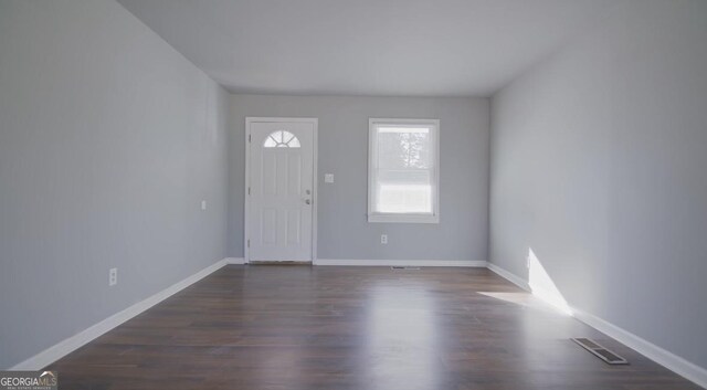 entrance foyer with dark hardwood / wood-style floors