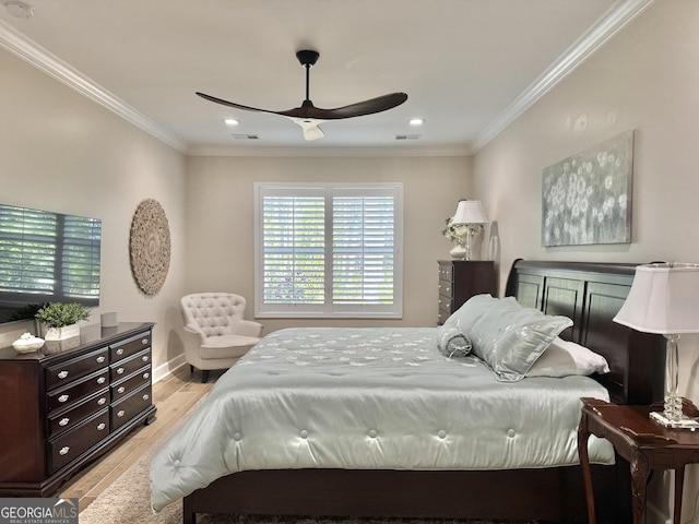 bedroom with ceiling fan, ornamental molding, and light hardwood / wood-style floors