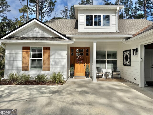 view of front of house with a garage and a front yard