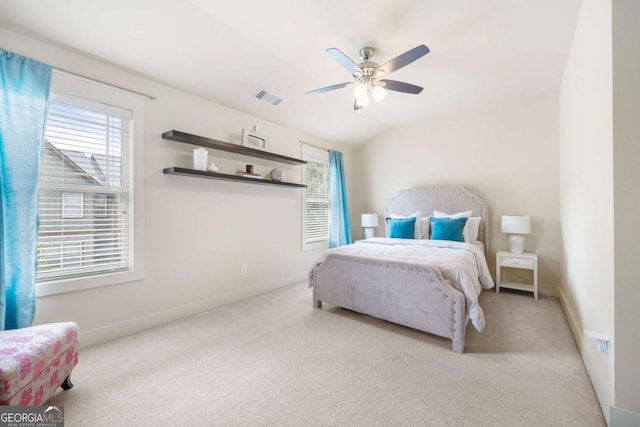 carpeted bedroom featuring lofted ceiling and ceiling fan