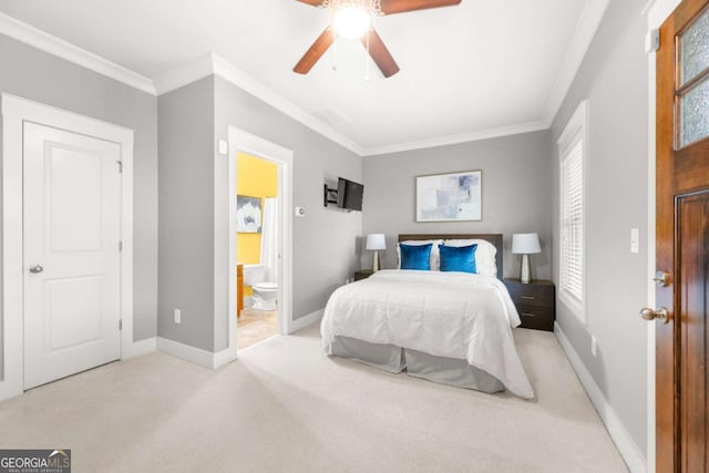 bedroom featuring crown molding, light carpet, connected bathroom, and ceiling fan