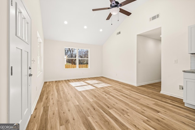 588 S Broad St, Toccoa, GA 30577 - unfurnished living room with high vaulted ceiling, a ceiling fan, light wood-style flooring, and recessed lighting