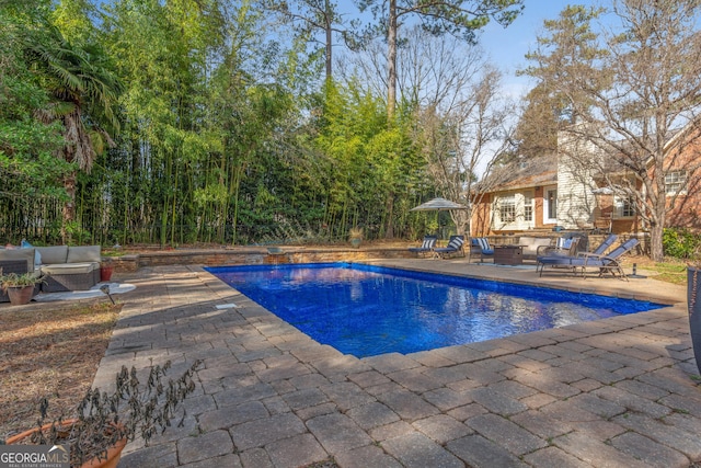 view of swimming pool with an outdoor hangout area and a patio area