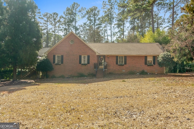 ranch-style house featuring crawl space and brick siding