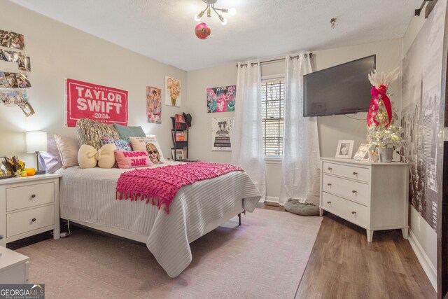 bedroom featuring hardwood / wood-style flooring