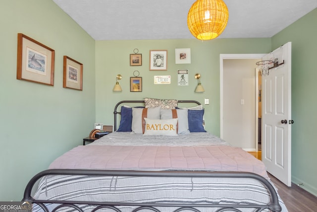 bedroom featuring wood finished floors