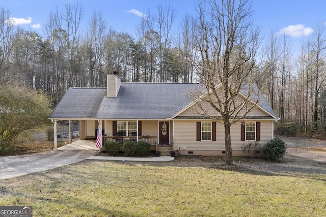 view of front of home featuring a carport, covered porch, and a front yard