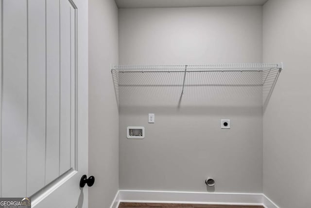 clothes washing area featuring washer hookup and hookup for an electric dryer