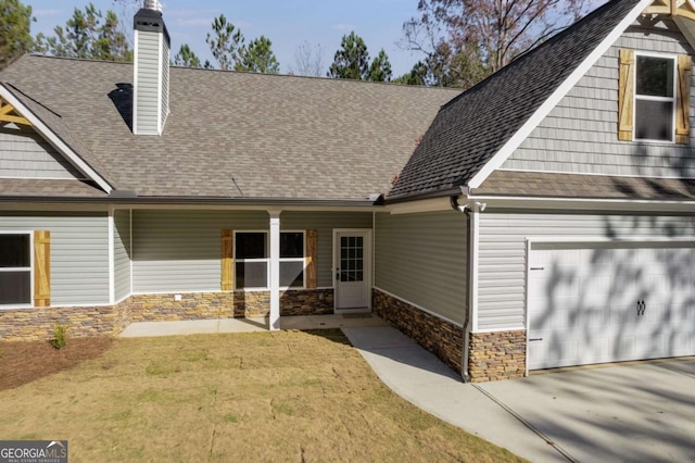 craftsman-style house with a front lawn