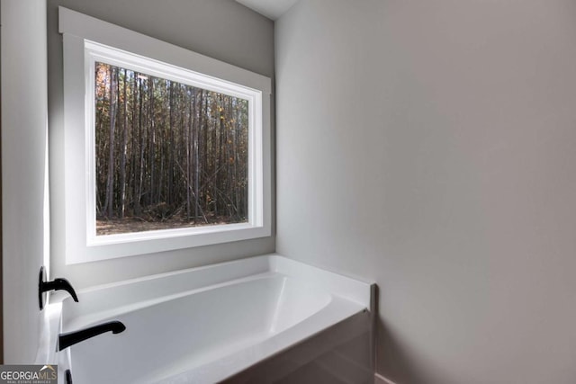 bathroom featuring a tub to relax in