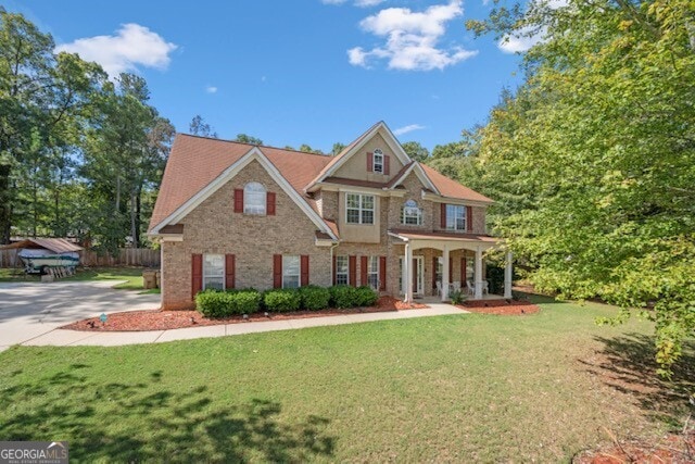 view of front facade with a porch and a front lawn