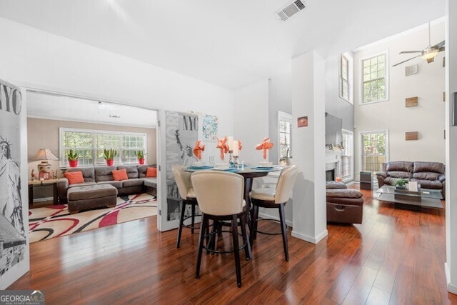 dining room with dark hardwood / wood-style floors and ceiling fan