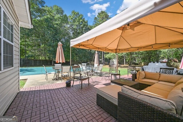 view of patio / terrace with an outdoor living space and a gazebo