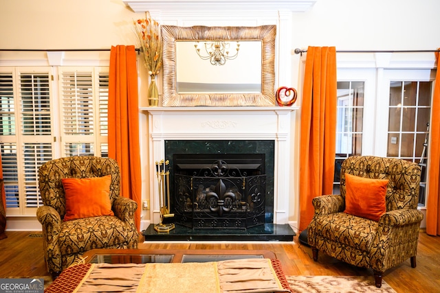 sitting room with hardwood / wood-style floors