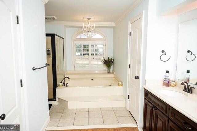 bathroom featuring a bathtub, vanity, a notable chandelier, ornamental molding, and tile patterned floors