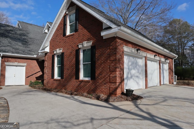 view of side of home with a garage