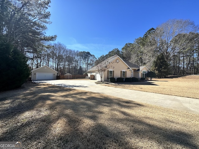 view of property exterior with an outbuilding and a garage