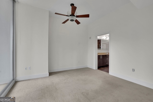 interior space with carpet floors and ceiling fan