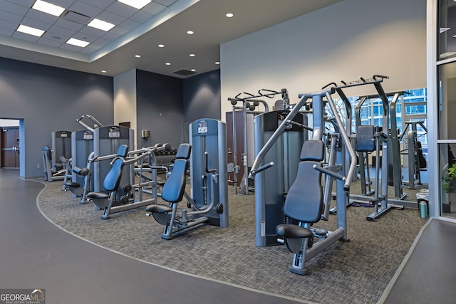 exercise room with a paneled ceiling