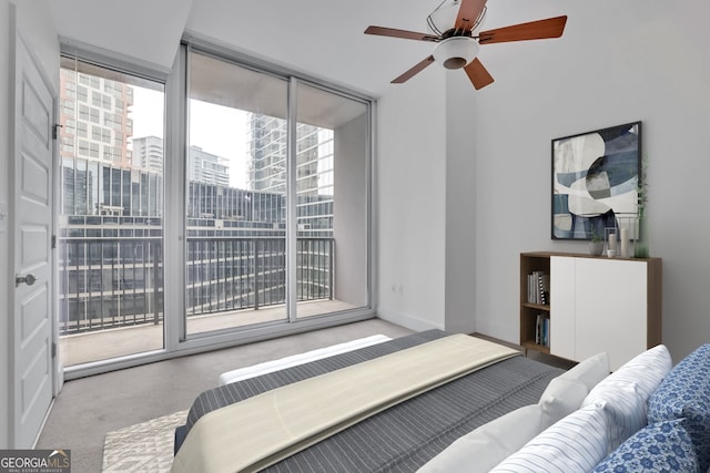 1080 Peachtree St NE Unit 804, Atlanta, GA 30309 - bedroom with a ceiling fan, access to exterior, multiple windows, and carpet floors