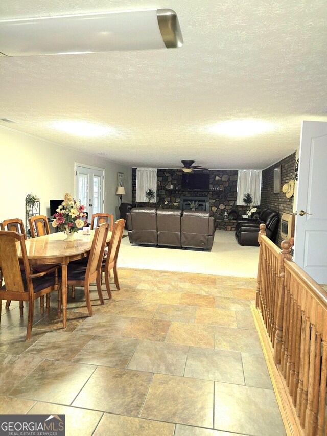 dining area featuring french doors and a textured ceiling