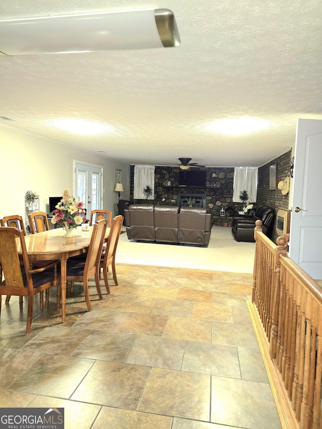 dining room with a textured ceiling and french doors