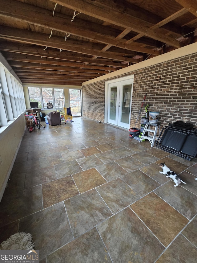 unfurnished sunroom with french doors