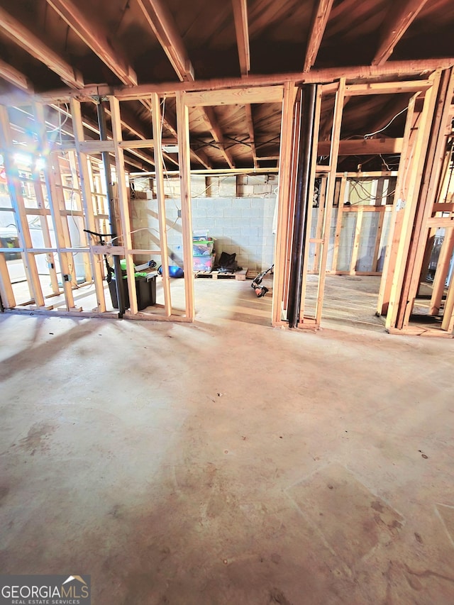 misc room with concrete flooring