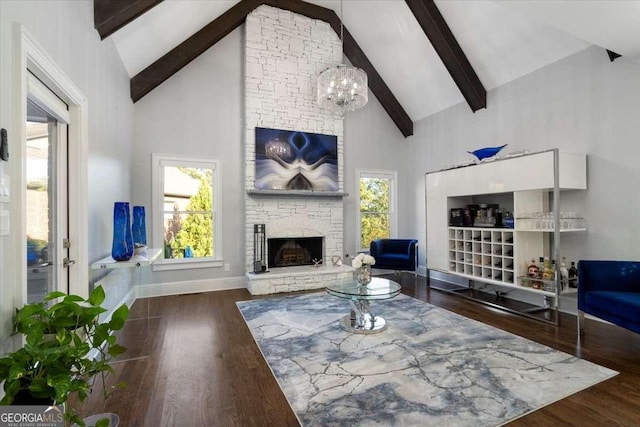 109 Slate Dr, Buford, GA 30518 - living room with high vaulted ceiling, beamed ceiling, a fireplace, a chandelier, and wood finished floors