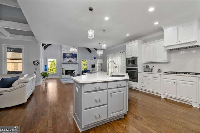 109 Slate Dr, Buford, GA 30518 - kitchen with oven, open floor plan, gas stovetop, stainless steel microwave, and recessed lighting
